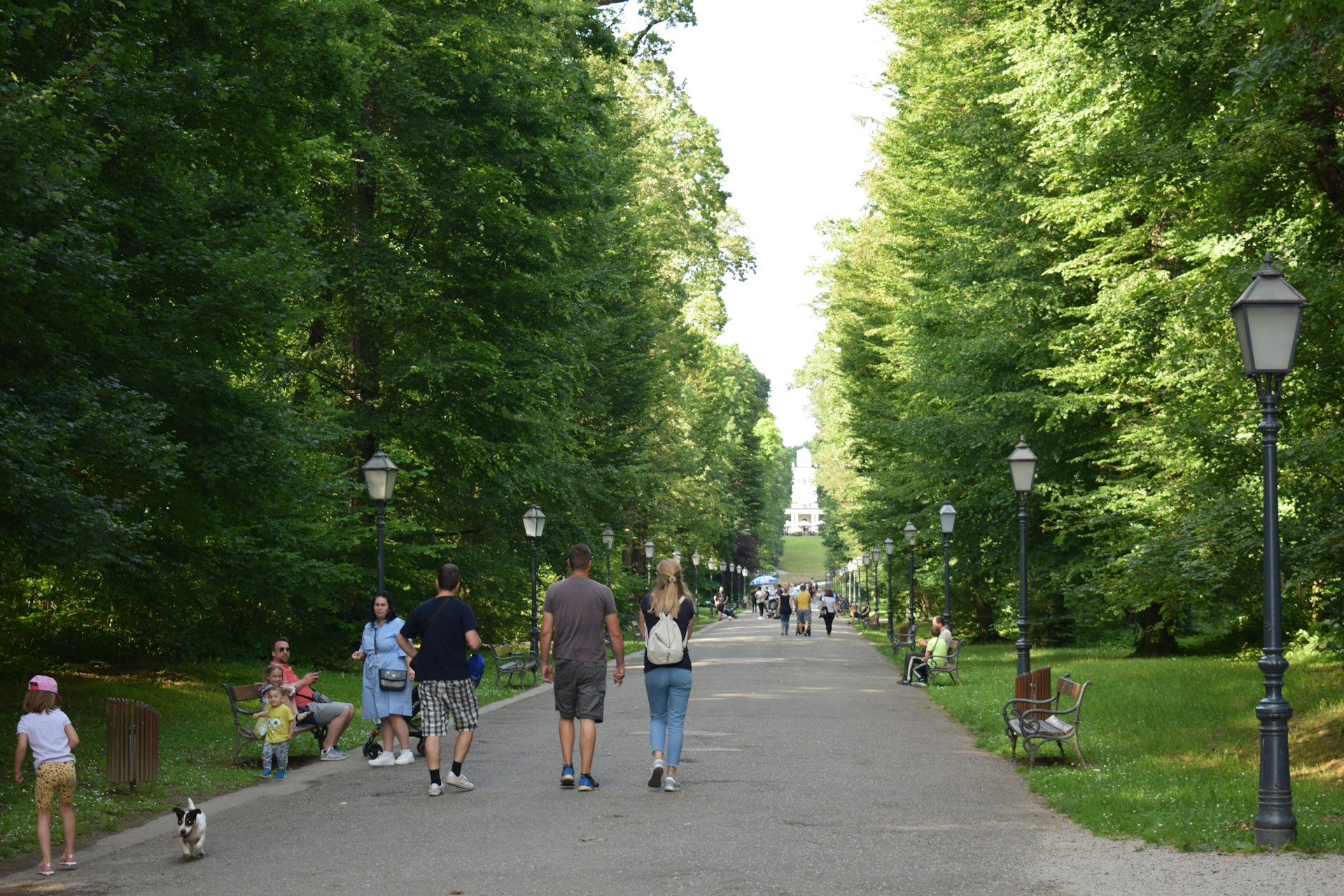 people-walking-in-park-and-children-playing